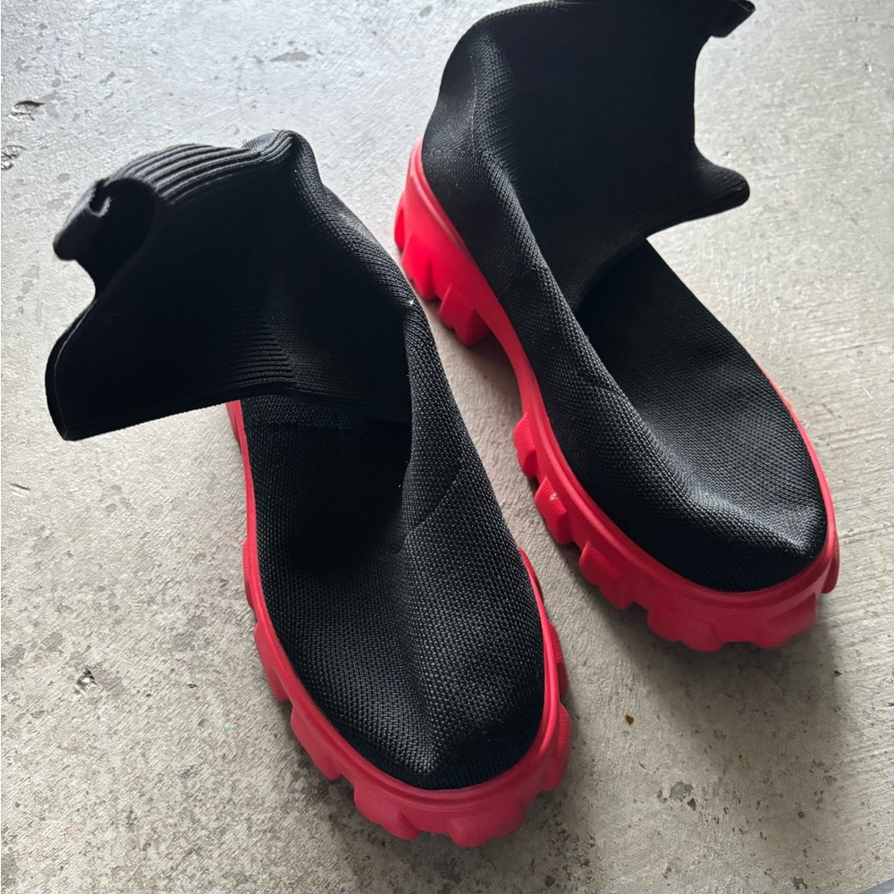Black sock shoe with fierce red bottom